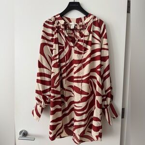 H&M lightweight beige and red zebra print tunic with puff sleeves, size M.